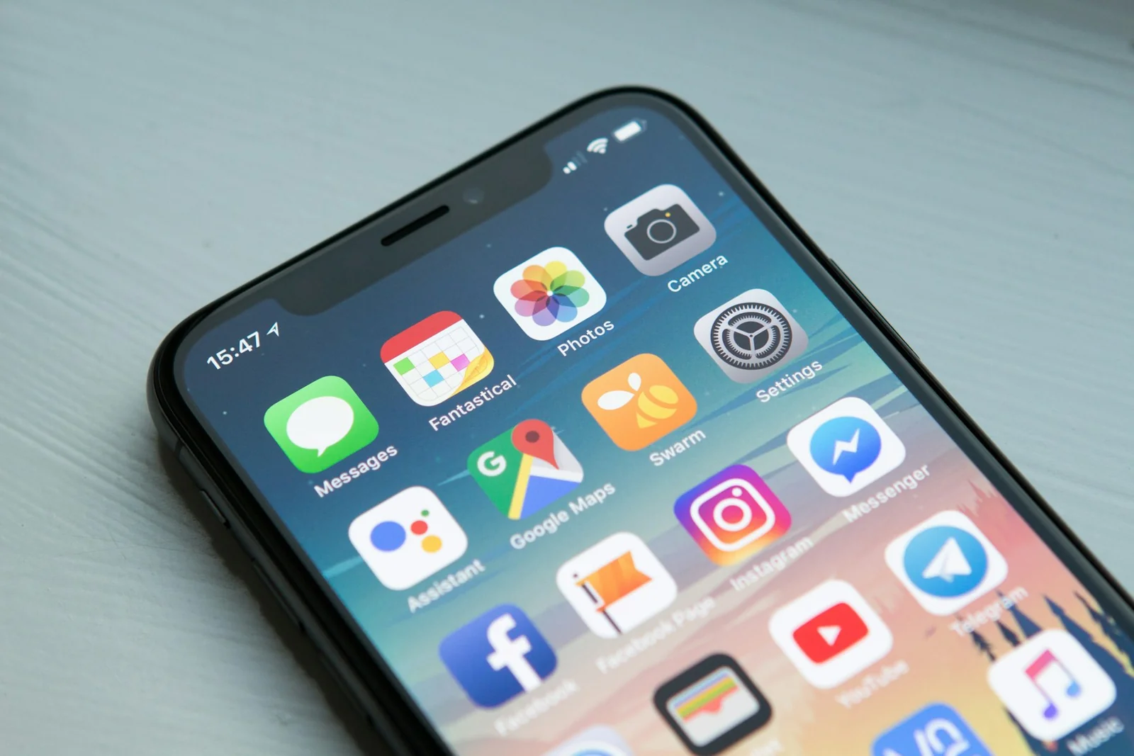 Smartphones on a desk showing a mobile application